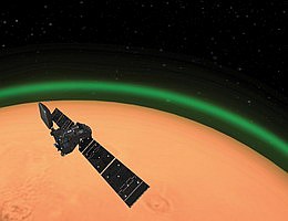 Künstlerische Darstellung des ExoMars Trace Gas Orbiters, der auf dem Mars tageslichtgrünen Sauerstoff aufspürt. Diese Emission, die auf der Tagseite des Mars entdeckt wurde, ähnelt dem nächtlichen Leuchten, das vom Weltraum aus in der Erdatmosphäre zu sehen ist. Vollständiger Artikel: ExoMars entdeckt einzigartiges grünes Glühen auf dem Roten Planeten. Copyright: ESA