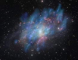 Künstlerische Illustration der von der kosmischen Strahlung angetriebenen Winde (blau und grün), überlagert von einem optischen Bild der Dreiecksgalaxie M33 (rot und weiß), das auf Beobachtungen mit dem VLT-Survey-Teleskop am Paranal-Observatorium der ESO in Chile basiert. (Bild: Institute for Research in Fundamental Sciences (IPM) & Europäische Südsternwarte (ESO))